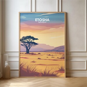 May include: A vintage travel poster with a sunset landscape featuring a lone tree in the foreground. The text "ETOSHA NAMIBIA" is at the top of the poster.