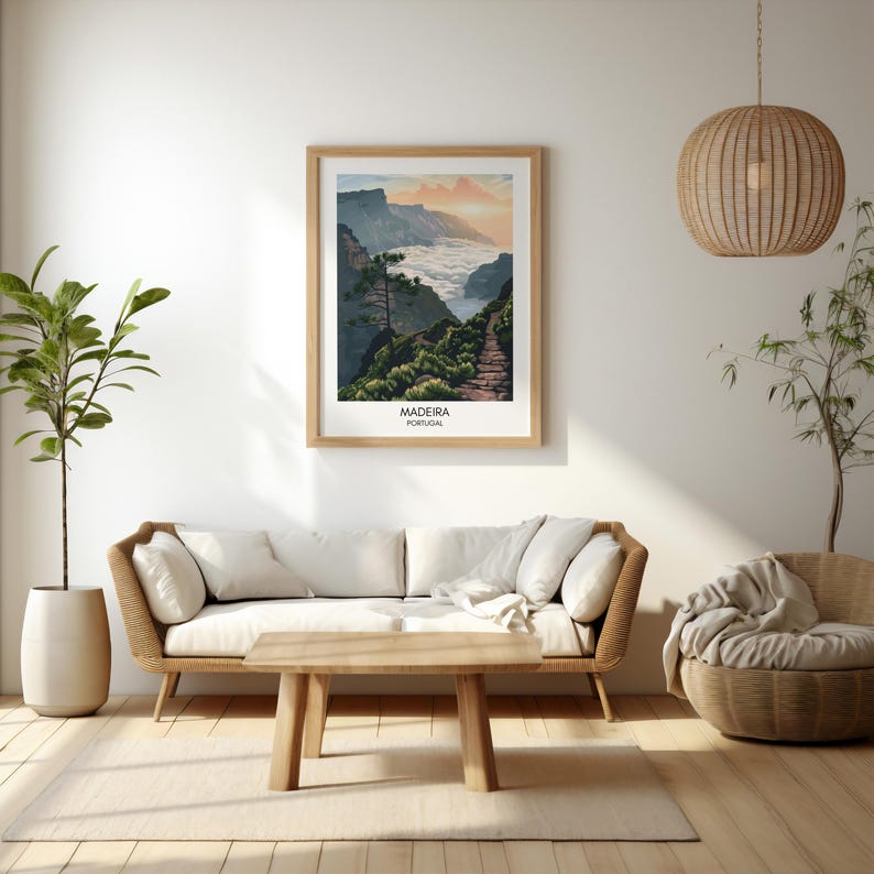May include: A framed print of a scenic landscape in Madeira, Portugal. The image shows a mountain path winding through a lush green valley with clouds in the background. The text "Madeira, Portugal" is printed below the image.