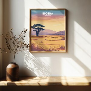 May include: A vintage travel poster with a sunset landscape featuring a lone tree in the foreground and the text "Etosha Namibia".