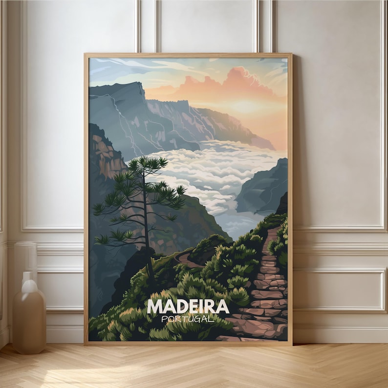 May include: A poster with a scenic view of Madeira, Portugal. The poster features a mountain path winding through a lush green landscape with a valley filled with clouds below. The text "MADEIRA PORTUGAL" is at the bottom of the poster.