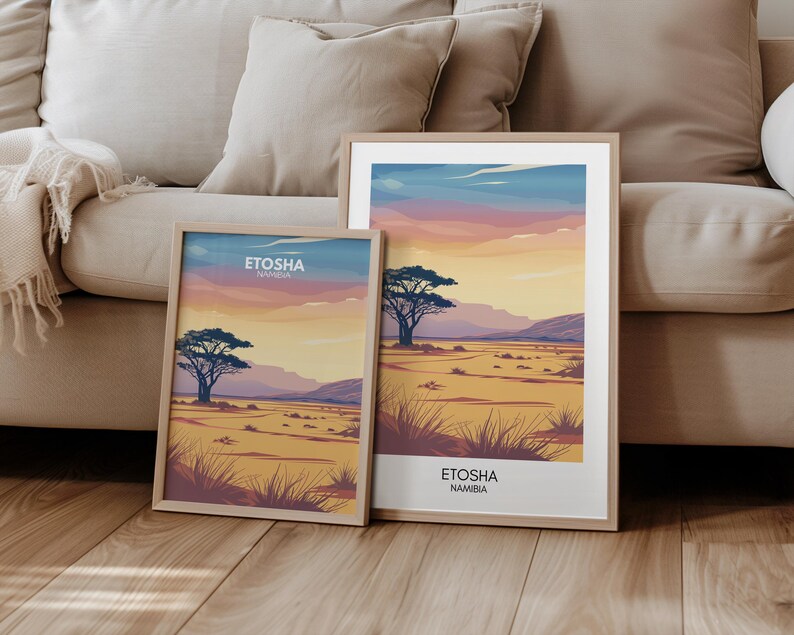 May include: Two framed landscape prints of the Etosha National Park in Namibia. The top print shows a sunset over a savanna with a lone acacia tree in the foreground. The bottom print shows a similar scene with a different perspective and a more detailed view of the savanna.