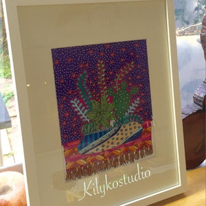 May include: A framed illustration of a colorful potted plant with a cactus, succulents, and other greenery. The background is a purple and pink patterned design with white dots. The artist's signature "Kilykostudio" is in the bottom right corner.