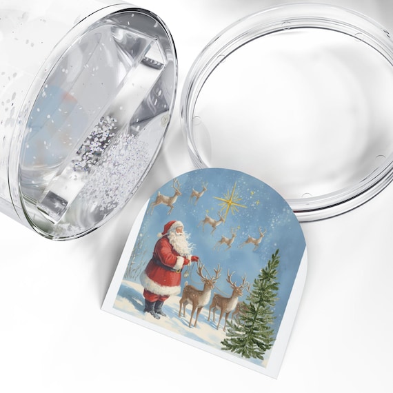 サンタとトナカイのスノードーム - お祝いのクリスマスデコレーション