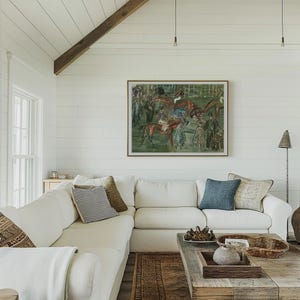 May include: A bright, airy living room with a white sectional sofa, patterned throw pillows, and a rustic wooden coffee table. A framed painting of horses hangs above the sofa. The room features a white ceiling and walls, with a wooden beam and a patterned rug.