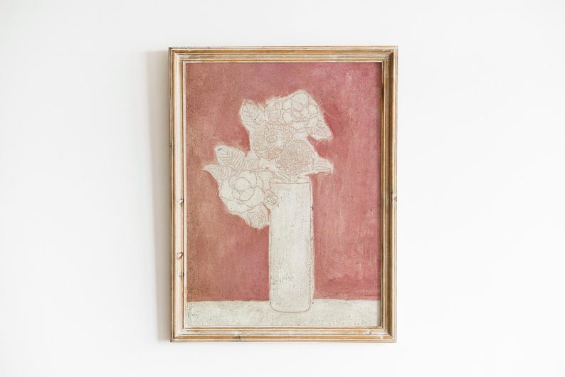 May include: A framed painting of a white flower arrangement in a white vase against a red background.