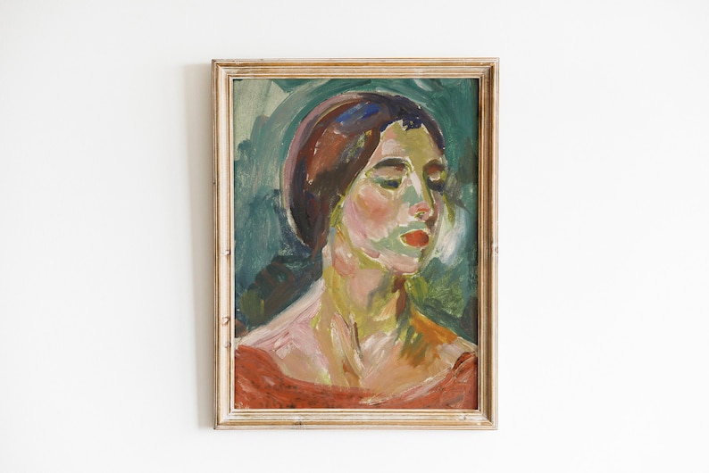 May include: A framed oil painting of a woman's portrait. The woman has dark hair and is wearing a red dress. The background is a green and blue abstract design.