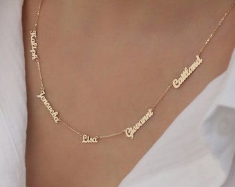 May include: Gold necklace with five names on it:  'Kalyn', 'Jenaueha', 'Lisa', 'Giovanni', and 'Cassland'.