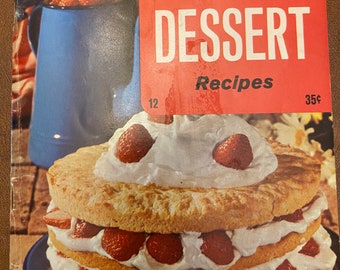 May include: A vintage cookbook cover featuring a layered strawberry cake with whipped cream frosting. The cover is red and white with the text "150 delectable DESSERT Recipes 35¢".