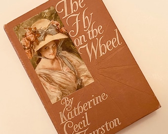 1900s Edwardian Book- The Fly on the Wheel  by Katherine Cecil Thurston Antique Hardcover Book with Decorative Cover Woman in Flower Hat