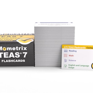 May include: A black box with the text "Mometrix TEAS 7 Flashcards" on it. A stack of white flashcards with the text "ATI TEAS Flashcards: Contents" on the top card. The contents of the flashcards are listed as: Reading, Math, Science, English and Language Usage.
