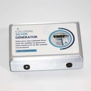 May include: A silver colloidal silver generator with a clear plastic cover. The cover displays text that reads "COLLOIDAL SILVER GENERATOR" and "HEALTH MATTERS." The generator has a built-in 5v to 24v module circuit board.
