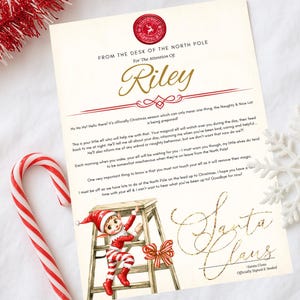 May include: A Christmas-themed letter from the North Pole addressed to Riley, with a Santa Claus signature. The letter includes a red and white candy cane and an illustration of an elf. The text reads "From the Desk of the North Pole".