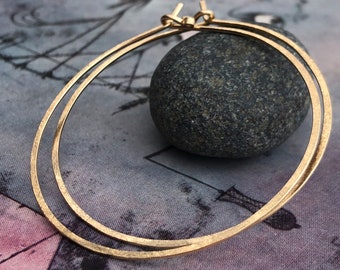 14k gold filled endless hoops hammered hoops with a matte gold patina