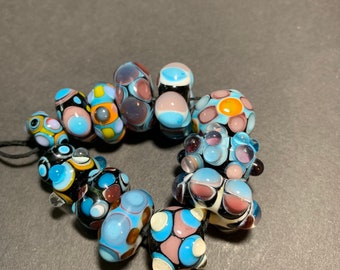 Set of handmade lampwork glass beads orphans, with lots of blues and purples