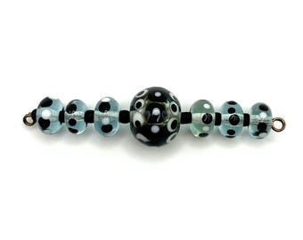 Set of black and clear turquoise lampwork glass beads for jewelry making