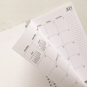 small monthly spiral planner | pages between months | start any time