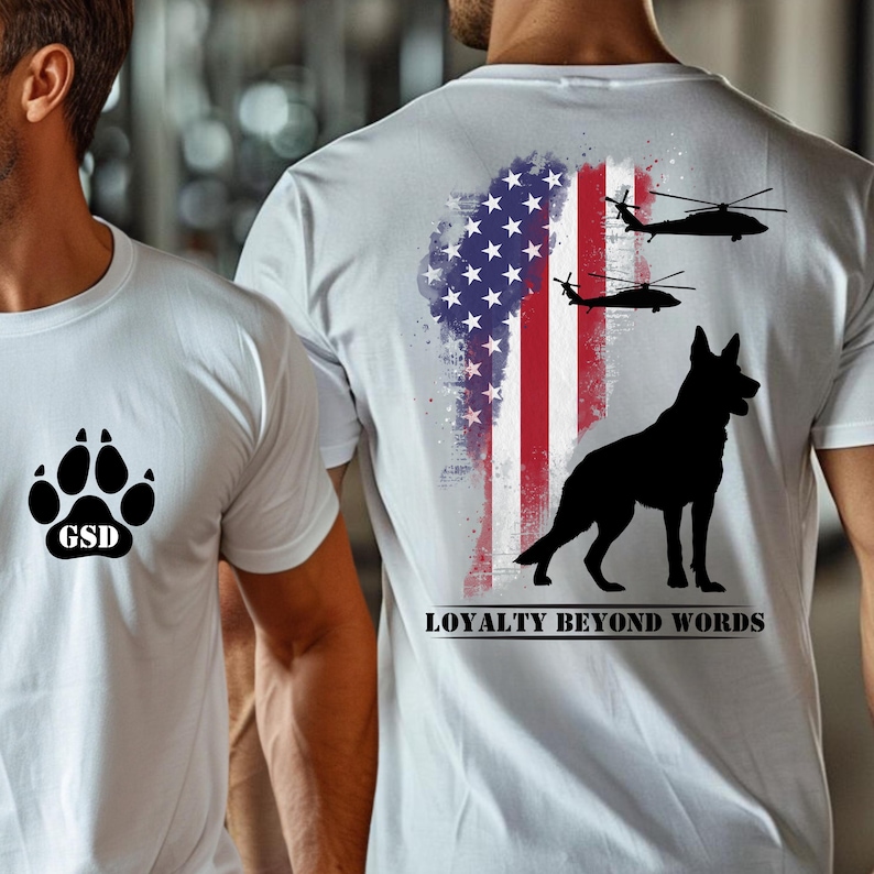May include: White t-shirts with graphic designs. One shirt has a paw print and "GSD". The other shows an American flag, helicopters, and a German Shepherd silhouette with the text "LOYALTY BEYOND WORDS."