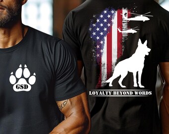 May include: Black t-shirts with white graphics. One shirt features a paw print with "GSD" text. The other shirt displays an American flag design, a German Shepherd silhouette, and the text "LOYALTY BEYOND WORDS".