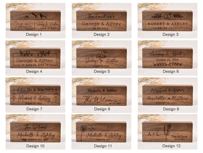 Puede incluir: Doce dise&ntilde;os diferentes para cajas de anillos de madera. Cada caja est&aacute; hecha de madera marr&oacute;n oscura y presenta una inscripci&oacute;n personalizada con nombres y fechas. Los dise&ntilde;os incluyen varios temas como monta&ntilde;as, flores y texto simple.