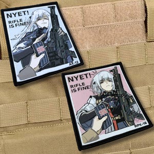 May include: Two rectangular embroidered patches featuring anime-style characters holding rifles. The left patch has a white background with text reading NYET! RIFLE IS FINE! and AK-12. The right patch has a pink background with text reading NYET! RIFLE IS FINE! and RPK-16.