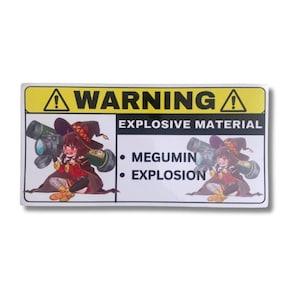 May include: A rectangular sticker with a yellow warning sign and the text "WARNING" above "EXPLOSIVE MATERIAL." It features an anime character with a weapon and the words "MEGUMIN" and "EXPLOSION."