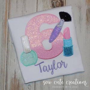 May include: A set of three ceramic mugs with a speckled, matte finish. The mugs are in shades of cream, light gray, and dark gray. Each mug has a simple, minimalist design, perfect for coffee or tea.