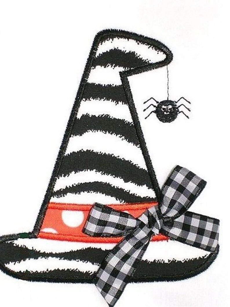 May include: Black and white striped witch hat with a red and white polka dot band and a black and white checkered bow. A black spider hangs from the hat.