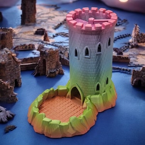 May include: A multi-coloured 3D printed tower with a dice rolling tray. The tower is a light green, blue, and pink gradient. The tower has a small door and windows. The dice rolling tray is a light orange colour.