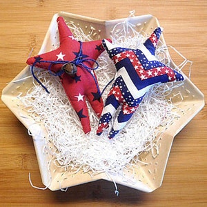 This is a pattern to make an item and not a finished item.
This is the digital E Pattern for easy 6 1/2-inch bowl filler primitive star ornaments. One of the points on the star is longer than the other.