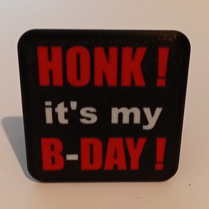 May include: Black and red rubber patch with the text "HONK! it's my B-DAY!"