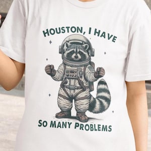 Funny Raccoon &quot;Houston, I Have So Many Problems&quot; T-Shirt, Quirky Animal Humor Tee, Unique Gift for Raccoon Lovers, Fun Statement Apparel