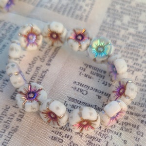 Hibiscus Flower Opaque White with a Metallic Volcano Wash and an AB Luster Finish 12mm 12 Pcs