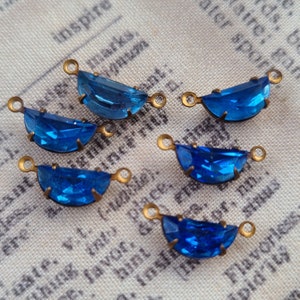 May include: A set of three ceramic mugs with a speckled, matte finish. The mugs are in shades of cream, light brown, and dark brown. Each mug has a simple, minimalist design and a rounded handle.