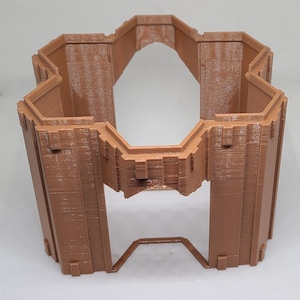 May include: A brown, 3D-printed architectural model with an octagonal design and an open centre. The structure has vertical supports and an arched opening, with a geometric base. The object has a textured surface and is likely a decorative piece.