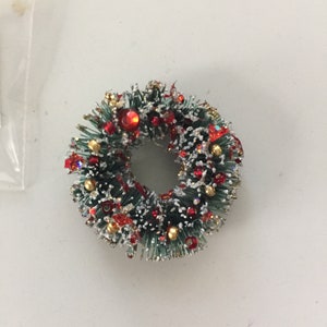 Corona navideña roja y dorada brillante