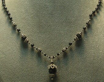 Hand knotted, black onyx gemstone beads, Swarovski crystal and Bali sterling silver beaded necklace.