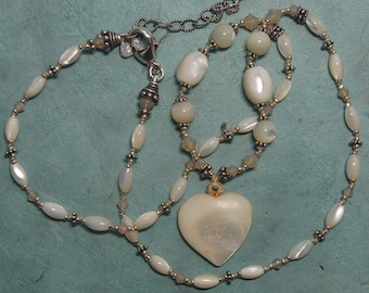 Hand knotted semi precious mother of pearl, Bali sterling silver beads and Swarovski crystal beaded necklace.