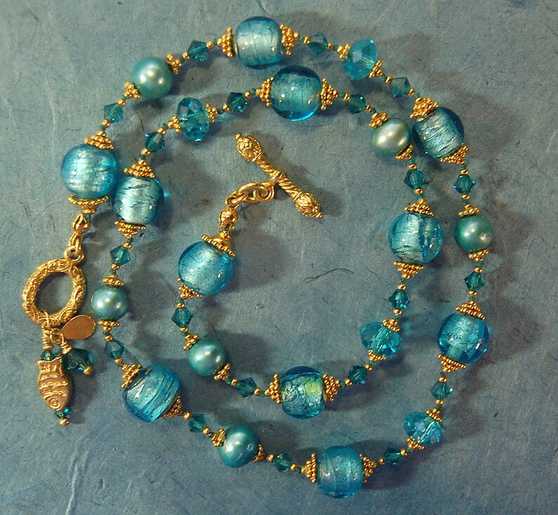Hand knotted teal and 24k gold vermeil Bali beaded necklace