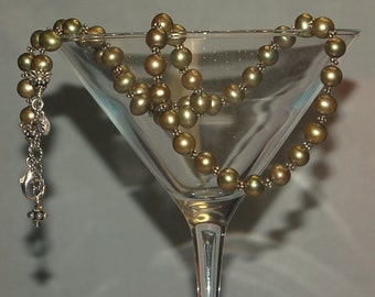 Hand knotted large gold tone green fresh water pearls, Swarovski crystal and Bali sterling silver beaded necklace