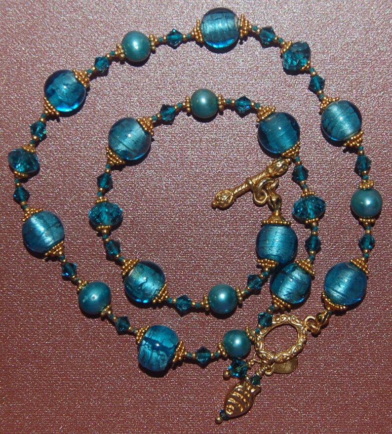 Hand knotted teal and 24k gold vermeil Bali beaded necklace