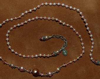 Hand knotted powder pink small fresh water pearls, Swarovski crystal and Bali sterling silver beaded necklace