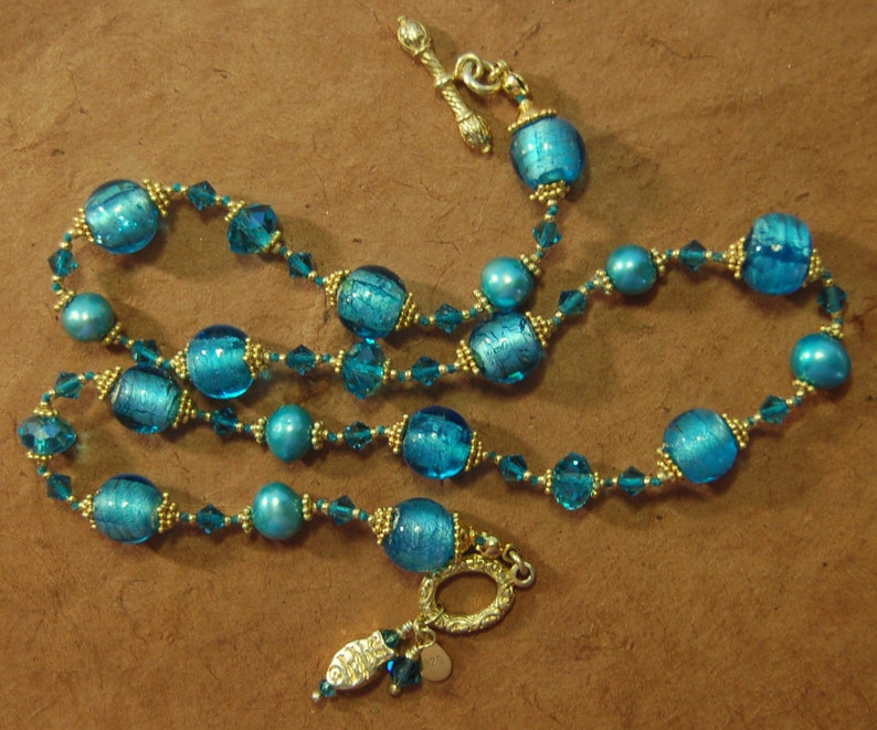 Hand knotted teal and 24k gold vermeil Bali beaded necklace