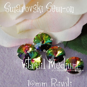May include: Five iridescent Swarovski sew-on crystals, 12mm rivoli, with a silver setting. The crystals have a vibrant color shift from green to purple. Text on the image reads "Swarovski Sew-on", "Vitrail Medium", and "12mm Rivoli".