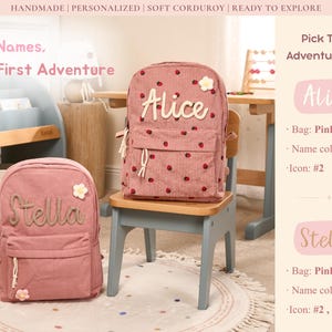 May include: Two pink corduroy backpacks, one with "Alice" and the other with "Stella" embroidered on the front. The Alice backpack has a strawberry pattern. Both have flower accents and are on a rug.