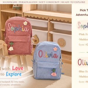 May include: Two corduroy backpacks, one pink and one blue, are shown. The pink backpack has the name "Sophia" in colourful letters, and the blue backpack has the name "Olivia". Both have a front pocket and decorative accents. The text "Packed with Love Ready to Explore" is also visible.