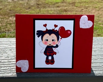 Mariquita, ¿quieres abejar mi tarjeta de San Valentín?