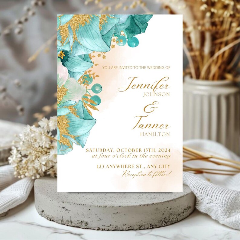 May include: Wedding invitation with a teal and gold floral design. The invitation reads "You are invited to the wedding of Jennifer Johnson & Tanner Hamilton, Saturday, October 15th, 2024 at four o'clock in the evening, 123 Anywhere St., Any City, Reception to follow!"