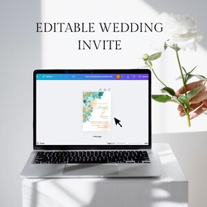 May include: A laptop screen displaying a wedding invitation template with a teal and gold floral design. The text on the invitation reads "Jennifer & Frances".