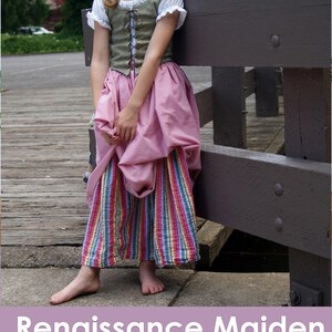 May include: A Renaissance Maiden PDF sewing pattern for a child's costume. The pattern includes a green vest with a lace-up front, a pink skirt, and a striped skirt. The pattern is available on Muse of the Morning.com.