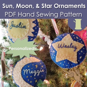 May include: A PDF pattern for hand-sewing felt ornaments shaped like a sun, moon, and star. The ornaments are decorated with blue and yellow felt and have names embroidered on them: Justin, Maggie, and Wesley. The text "Personalized!!" is in a green speech bubble.